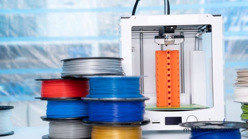 ABS and PLA Filament Next to 3D Printer