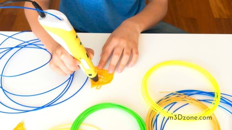 Kid Using A Yellow 3D Pen